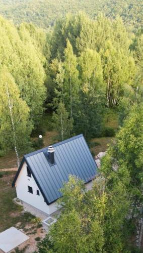 an overhead view of a white house in a forest at Wild Beauty Brezna in Pluzine