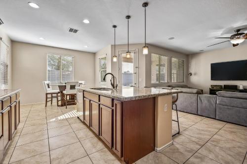 an open kitchen and living room with a couch at The Revel House in Phoenix
