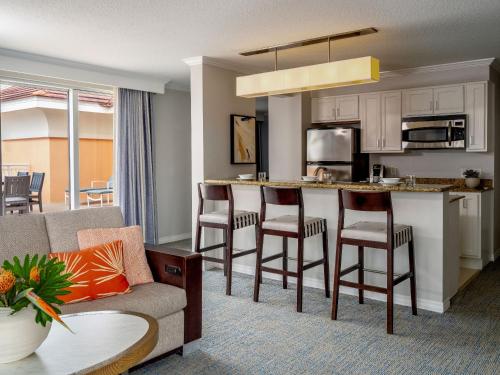 a living room with a couch and a kitchen at Hyatt Regency Clearwater Beach Resort & Spa in Clearwater Beach