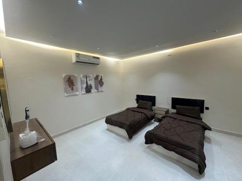 Ένα ή περισσότερα κρεβάτια σε δωμάτιο στο شقة فاخرة مودرن