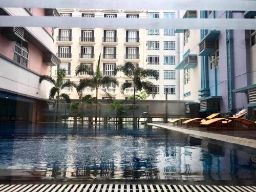 a building with a pool in front of a building at RER-101 Newport Boulevard, Pasay City, Metro Manila, Philippines near NAIA Terminal 3 in Manila