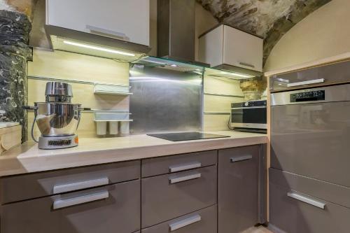 a kitchen with a mixer on the counter at le loft du vieux lyon in Lyon
