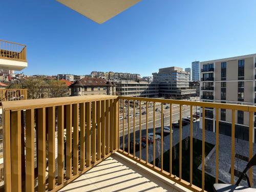 a balcony with a view of a city at BW Crown Garden Residences in Sajmište