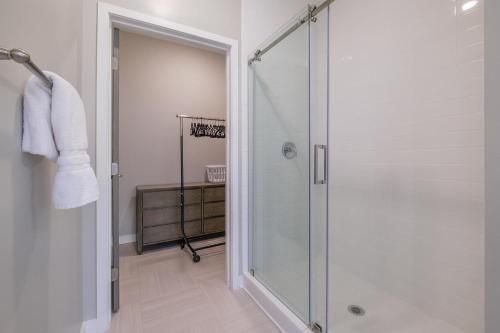 a shower with a glass door in a bathroom at Landing at The 600 - Birmingham in Birmingham