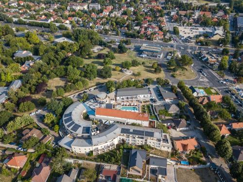 an aerial view of a building in a city at CE Plaza Hotel in Siófok