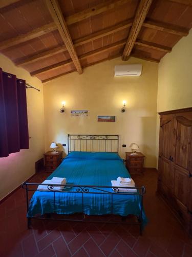 Ένα ή περισσότερα κρεβάτια σε δωμάτιο στο Agriturismo Il Loghino