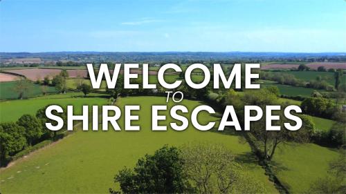 a view of a green field with the words welcome to shine escapes at Hot Tub Luxury Glamping - Private Stargazing Patio in Yarpole