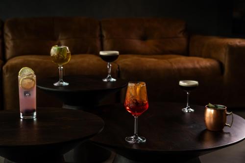 a group of tables with wine glasses on them at Hotel Loa in Hvolsvöllur