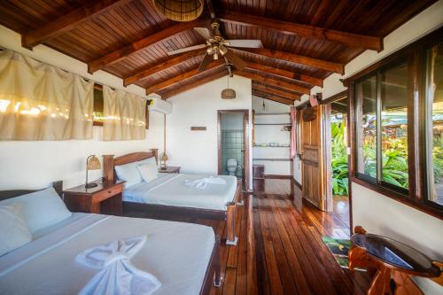 Cama o camas de una habitación en Las Cotingas Ocean View