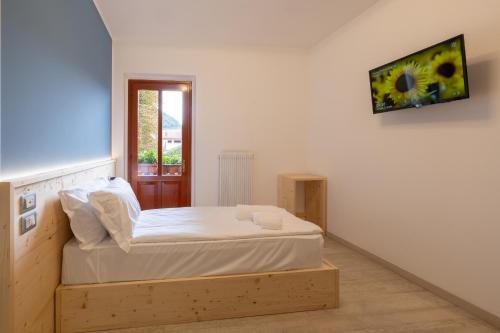 Katil atau katil-katil dalam bilik di Comune Rustico Sport Hotel