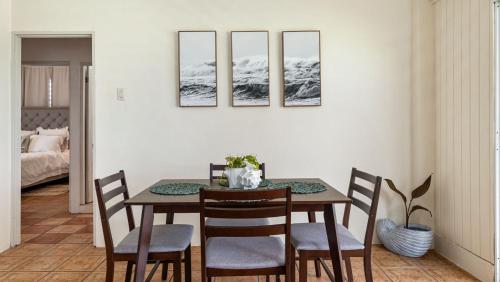 a dining room with a table and chairs at Yellow Beach House Unit B - 2 min walk from the Beach in Aguada
