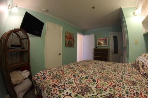 a bedroom with a bed and a tv on the wall at Winterplace Ski in Ski Out D101 First Floor in Ghent