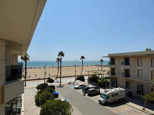 a view of the beach from the balcony of a condo at Reinapart Patacona Beachfront Seaview in Valencia
