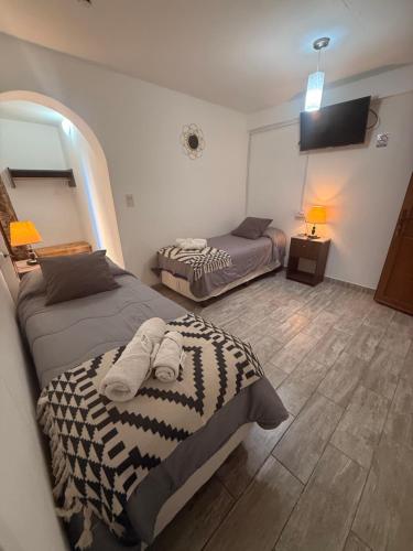 Postel nebo postele na pokoji v ubytování MS Hotel Campos 26