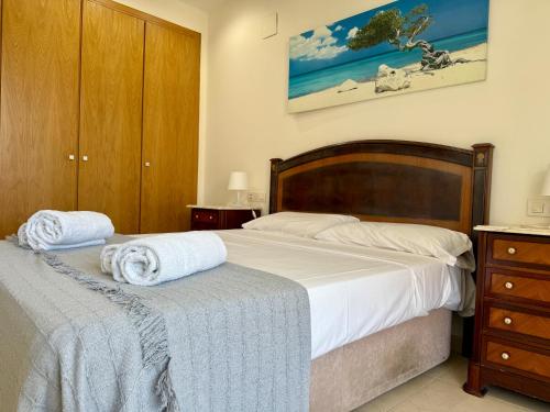 a bedroom with two beds with towels on them at Reinapart Patacona Beachfront Seaview in Valencia