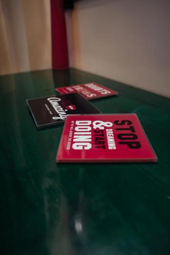 two cards sitting on top of a green table at Ignatia Hotel in Nafplio