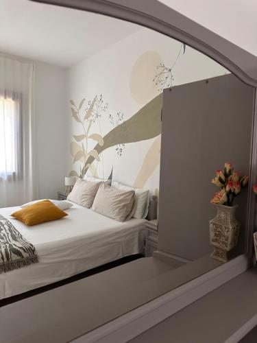 Postel nebo postele na pokoji v ubytování Villa Marinella Apartments - Locazione Turistica