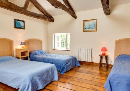 Katil atau katil-katil dalam bilik di Le Manoir de Kerroc'h