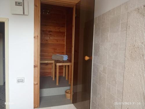 a bathroom with a shower and a table in a room at 3B Firenze in Capraia e Limite