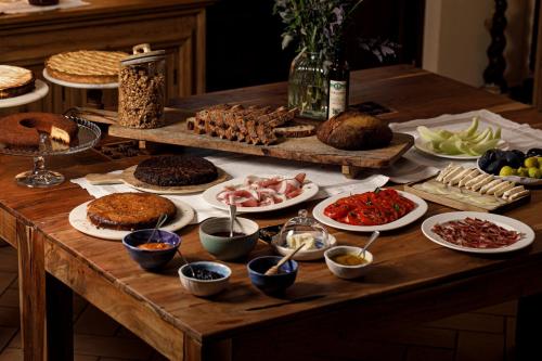 a table with many different types of food on it at Agriturismo Emidio Pepe in Torano Nuovo