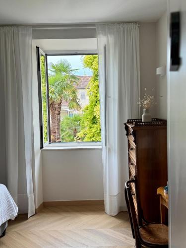 Ένα ή περισσότερα κρεβάτια σε δωμάτιο στο Ameli Heritage rooms & apartments