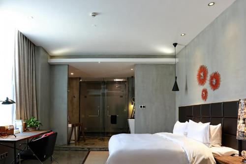 Cama o camas de una habitación en Time Tunnel Designer Hotel Xi'an