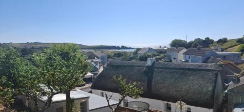 an overhead view of a city with houses and trees at Dairy Cottage Courtyard accommodation in Bunmahon