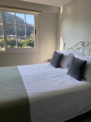 Postel nebo postele na pokoji v ubytování Apartamento Itaipava Granja Brasil