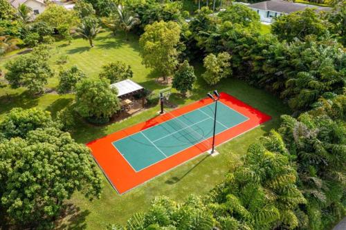 an overhead view of a tennis court in a yard at Sawgrass Estates in Plantation