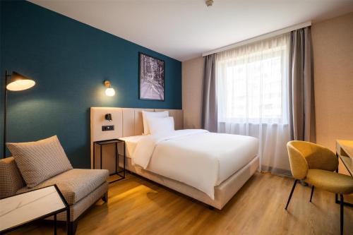 Metropolitan Hotel Sofia, a member of Radisson Individualsにあるベッド