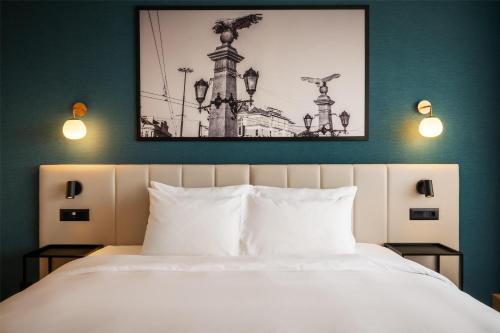 Metropolitan Hotel Sofia, a member of Radisson Individualsにあるベッド