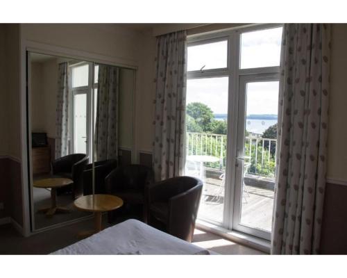 a hotel room with a view of a balcony at Sea Side Hotel in Skegness