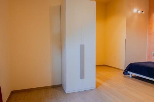 a white closet in a room with a bed at B&B Etesia in Vibo Valentia