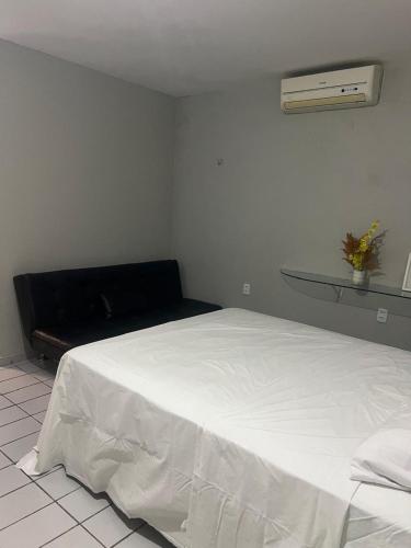 Ένα ή περισσότερα κρεβάτια σε δωμάτιο στο Apartamento Icaraí prox ao cumbuco
