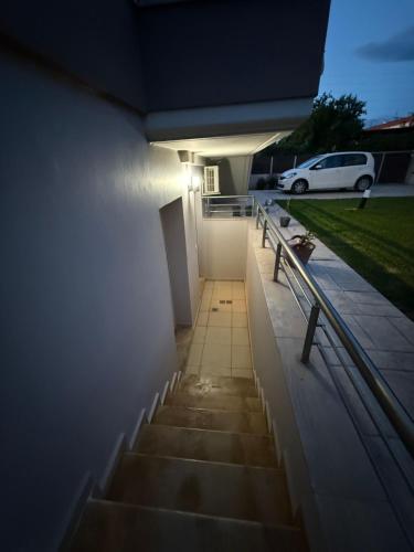 a stairway with a bench next to a building at Nado House in Vrahati