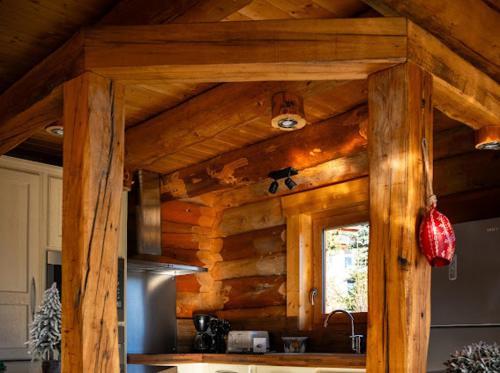 a kitchen with wooden walls and a counter top at Chalet Inuit in Font Romeu Odeillo Via