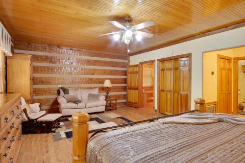 a bedroom with a bed and a ceiling fan at Golf and Hike Nature Escape with Sauna in Hephzibah in Hephzibah
