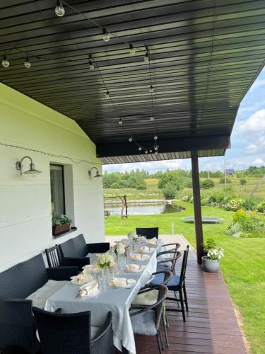 a row of tables and chairs on a patio at Vila Trakai in Trakai