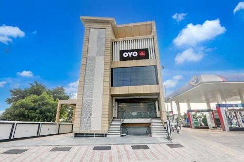 a building with aeyes sign on the side of it at Hotel O Nirmal Restaurant Bar Banquet & Rooms Faridapur in Alambagh
