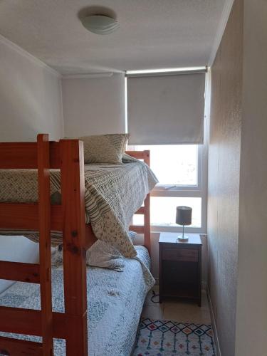 Giường trong phòng chung tại Departamento Marina Sol III