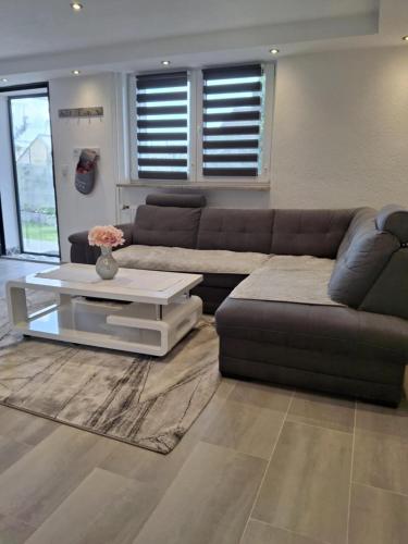 a living room with a couch and a coffee table at FeWo Lupi in Stockach