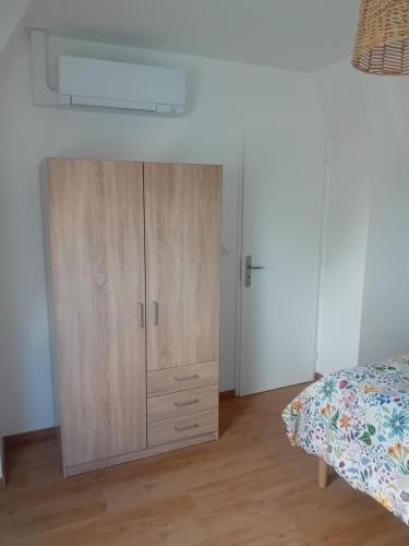 Ein Bett oder Betten in einem Zimmer der Unterkunft Le Gîte de la Vieille Grange