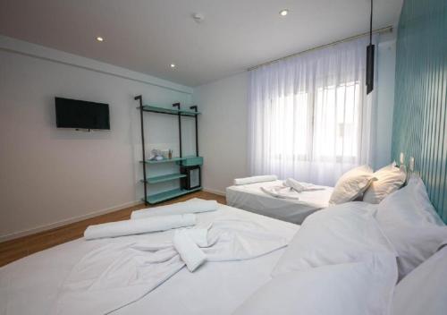 Postel nebo postele na pokoji v ubytování Hesperus Hotel
