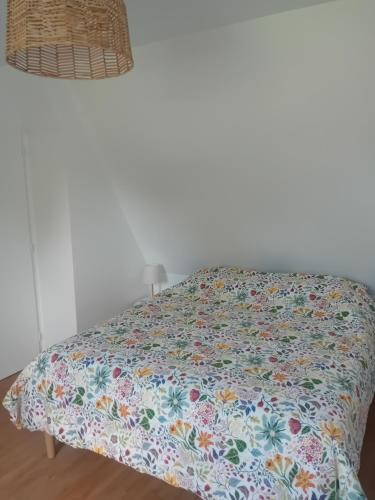 Ein Bett oder Betten in einem Zimmer der Unterkunft Le Gîte de la Vieille Grange
