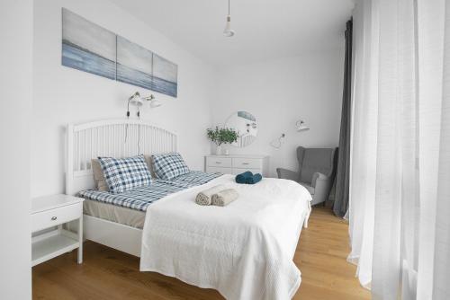 En eller flere senge i et værelse på Perfect Moments Apartments, Šventoji