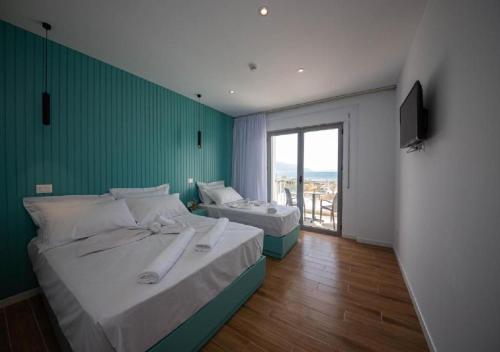 Postel nebo postele na pokoji v ubytování Hesperus Hotel