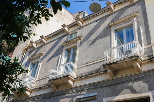a building with balconies on the side of it at La Dolce Vita in Catania