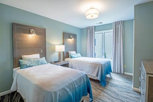 a hotel room with two beds and a window at Massanutten's Woodstone Meadows by TripForth in McGaheysville