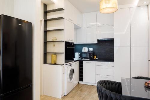 Η κουζίνα ή μικρή κουζίνα στο Rebany Apartman 2 Central Location