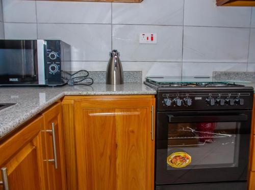 Kuchyň nebo kuchyňský kout v ubytování Cozy Up in Cozy home